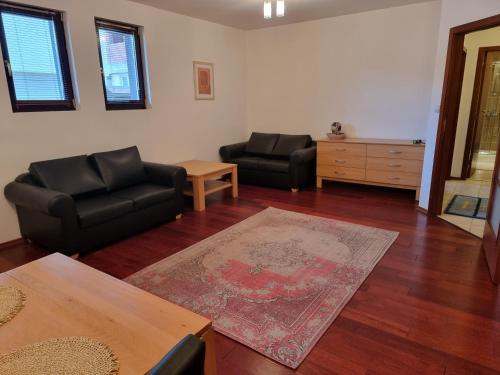 A seating area at Chalet Montagne Bansko apartment