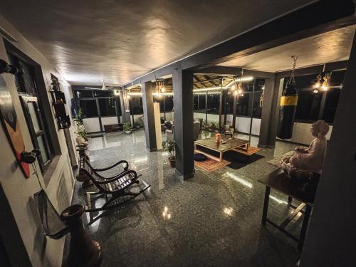 a living room with a couch and a table at Karvaan B&B - 2bhk Homestay in Pālampur