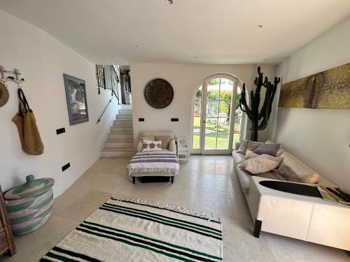 a living room with a couch and a table at Villa St. Georges in Piran