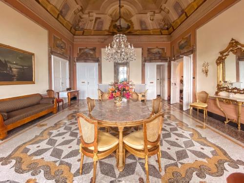 a dining room with a table and chairs at Villa Gelsomino Exclusive House in Santa Margherita Ligure