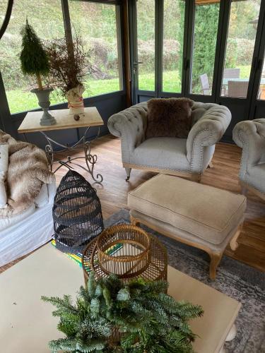 a living room with couches and a christmas tree at Il Borghetto Andrea Tafi in Lamporecchio
