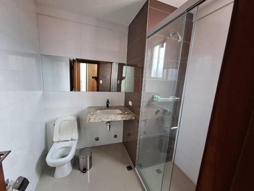 a bathroom with a toilet and a sink and a shower at Alissthon in Santa Cruz de la Sierra