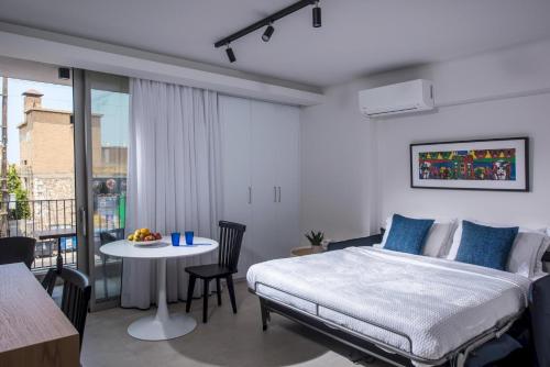 Ένα ή περισσότερα κρεβάτια σε δωμάτιο στο Athinais Blue
