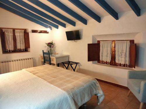 Ένα ή περισσότερα κρεβάτια σε δωμάτιο στο Hostal los Aromas