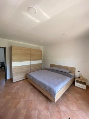 a bedroom with a large bed in a room at Apartma na vinski kmetiji in Koper