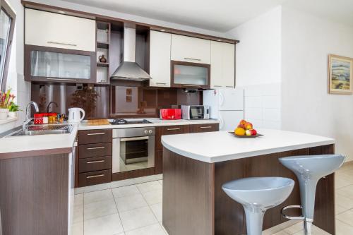 Kuchyň nebo kuchyňský kout v ubytování Apartment Orange