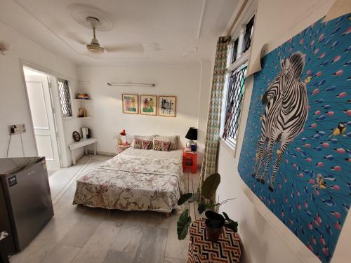 a bedroom with a bed and a painting of a zebra at Nice Bedroom with Private Ensuite Bathroom in New Delhi