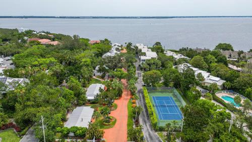 an aerial view of a resort with a tennis court at Little Gull Cottages in Longboat Key