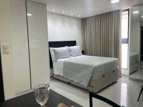 Ένα ή περισσότερα κρεβάτια σε δωμάτιο στο Flat Alto Padrão em Tambaú