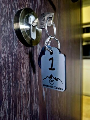 a key chain with a tag attached to a door at Zakopiański Zakątek in Zakopane