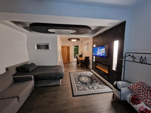 a living room with a couch and a fireplace at 31 London Road Liverpool Studio Sleeps 4 in Liverpool