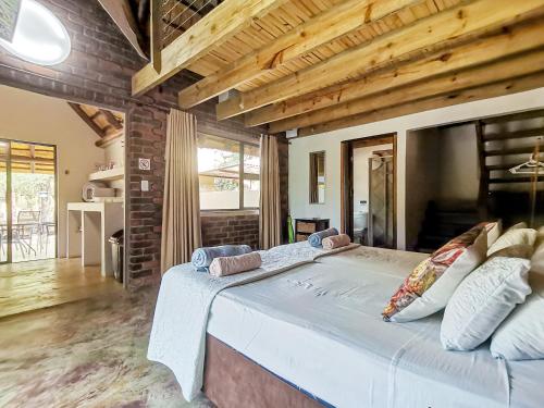 a bedroom with a large bed in a room at Athule Marloth in Marloth Park