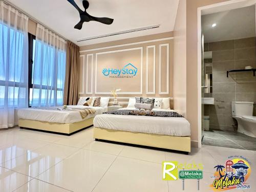 Katil atau katil-katil dalam bilik di Bali Residence Melaka By Heystay Management