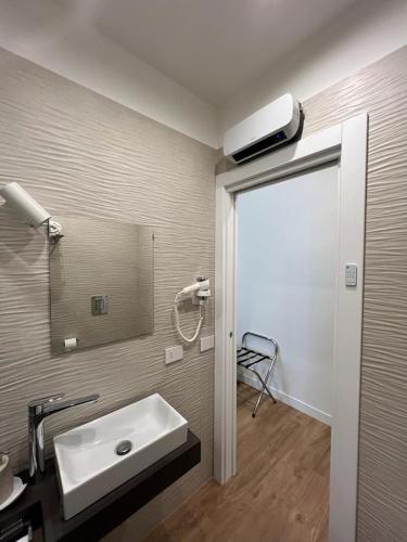 a bathroom with a sink and a mirror at Casa Imperatore in Naples