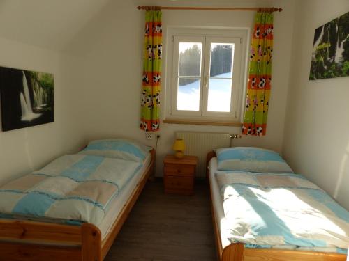 Postel nebo postele na pokoji v ubytování Ferienhaus Wohleser
