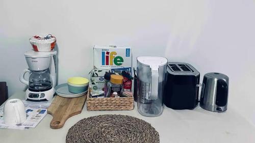 a counter top with a bunch of kitchen items on it at Richmond Cozy Place 2 in Richmond