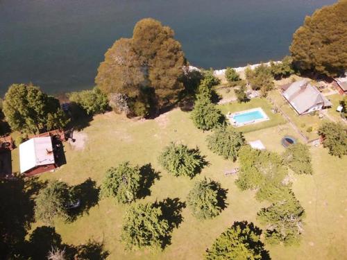 an aerial view of an island with a tent and trees at Cabañas Canto del Tiuque in Pishuinco