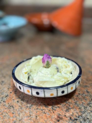 a bowl of ice cream sitting on a table at Riad Mazar in Fès