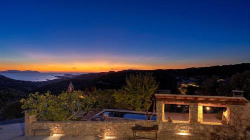 a view of the sunset from a house at Peaceful & Secluded Retreat House Kod Kapetana Hvar in Veliko Grablje