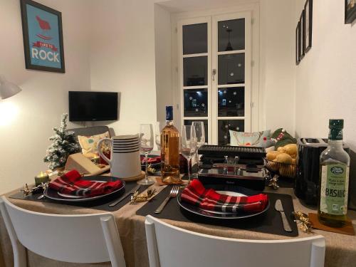 a dining room table with a christmas table at AU 47 ALLÉES D'ETIGNY - CENTRAL & STANDING - avec parking, linge de lit et de toilette inclus in Luchon