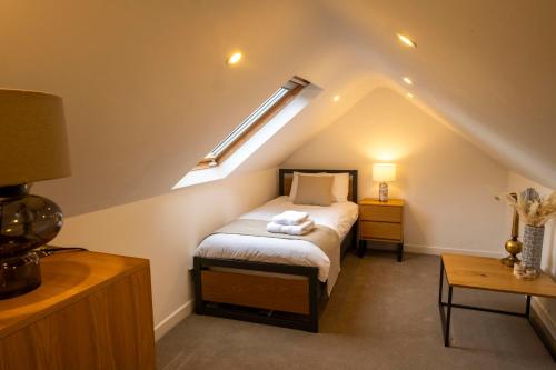 a bedroom with a bed in a attic at The Hillcrest, Luxury Accommodation in Castleblayney Town in Castleblayney