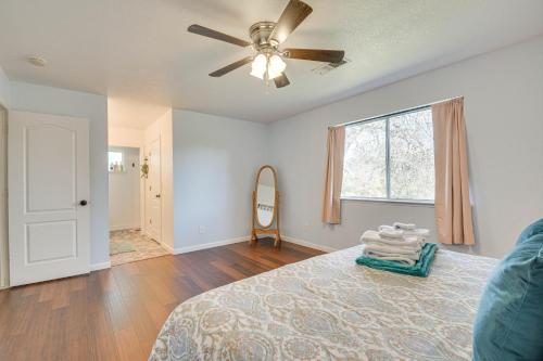 a bedroom with a bed and a ceiling fan at Bright and Cozy Mariposa Getaway 46 Mi to Yosemite! in Mariposa