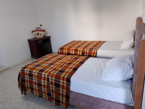 Ein Bett oder Betten in einem Zimmer der Unterkunft Dar ettawfik