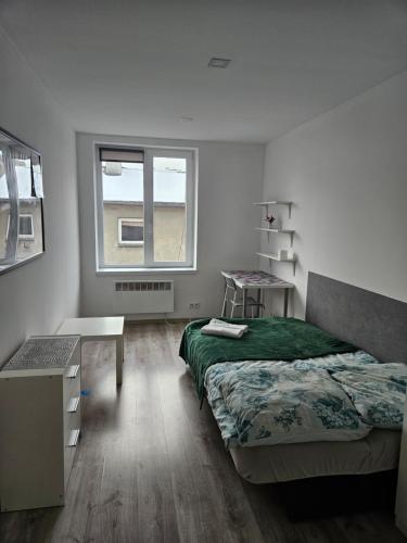 Posteľ alebo postele v izbe v ubytovaní Północna Rooms