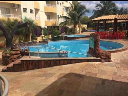 a swimming pool in a resort with a resort at Condominio Residencial Thermas Place in Caldas Novas