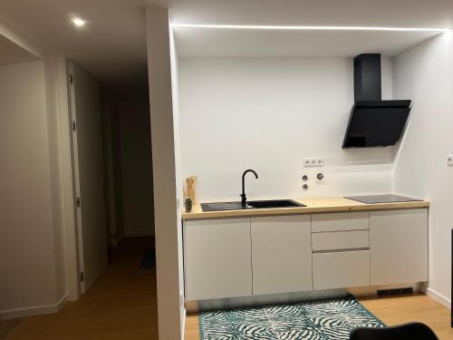 a kitchen with a sink and a counter top at Casa da Calvaria in Calvária