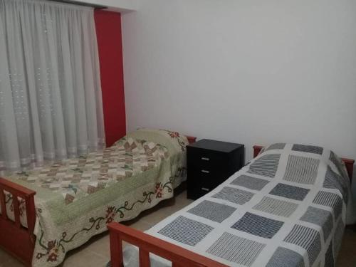 Postel nebo postele na pokoji v ubytování Casa Grande en Necochea, Proxima a la Playa