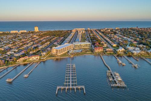 an aerial view of a marina with a ladder in the water at The Pearly Palm in Melbourne Beach