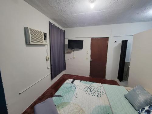 Un pat sau paturi într-o cameră la departamento serdan II