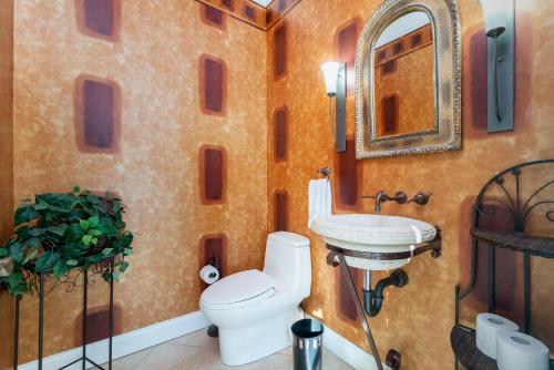 a bathroom with a toilet and a sink at Villa Hibiscus-Waterfront-Punta Gorda FL in Punta Gorda