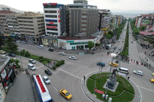 a city with a street with cars and buildings at Loft Suite Residence in Bursa