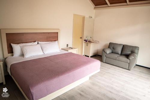 Cama o camas de una habitación en RIO HOTEL Y GLAMPING