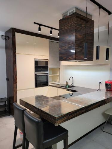 Η κουζίνα ή μικρή κουζίνα στο Apartament Walendów Park