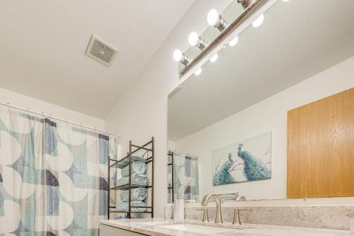 a bathroom with a sink and a large mirror at Bourbonnais Townhome about 3 Mi to ONU Campus! in Bourbonnais