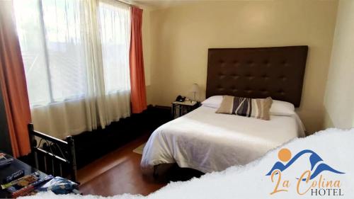 Säng eller sängar i ett rum på La Colina de Riobamba