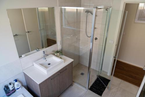 a bathroom with a sink and a shower at Homely Entire house in Clyde in Clyde