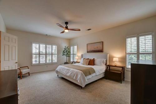 a bedroom with a bed and a ceiling fan at Sedona Retreat W/ Tesla Mobile Charger in Sedona