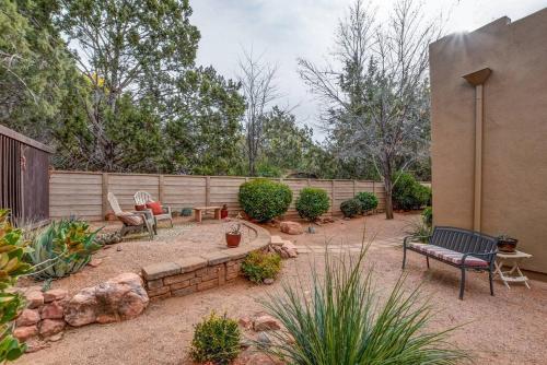a garden with a bench and a fence at Sedona Retreat W/ Tesla Mobile Charger in Sedona