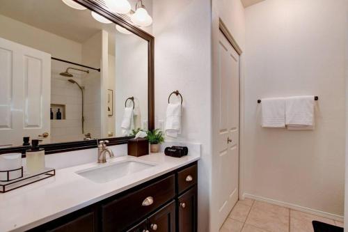 a bathroom with a sink and a large mirror at Sedona Retreat W/ Tesla Mobile Charger in Sedona