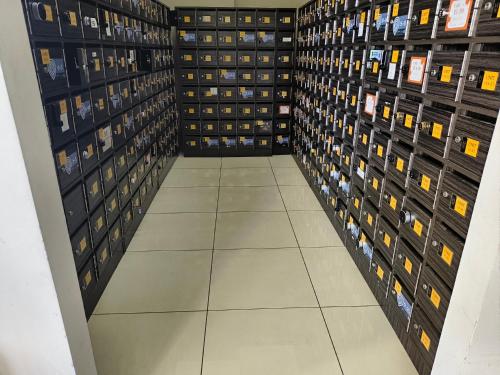 a room filled with lots of wine bottles at Pleasant Amenities at ITCC Manhattan Suites in Penampang