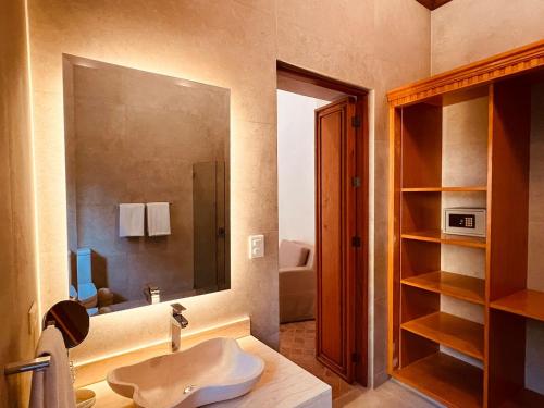 a bathroom with a sink and a mirror at Casalinda San Miguel in San Miguel de Allende