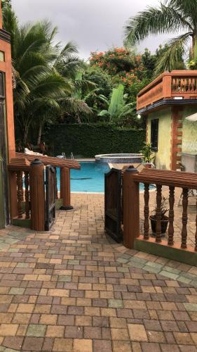 a patio with a fence and a swimming pool at Hidden Oasis in Mandeville in Mandeville