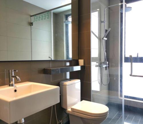 a bathroom with a sink and a toilet and a shower at Vista Residence Genting Highland in Genting Highlands