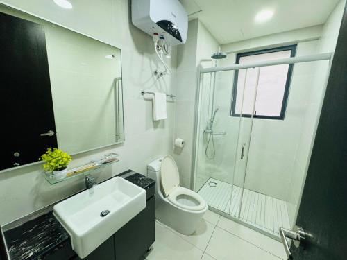 a bathroom with a toilet and a sink and a shower at JB Country Garden J Agape Homestay 2106-6A in Johor Bahru