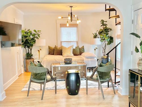 a living room with a couch and a table and chairs at 5STAR Close2BOSTON Private Stylish HOME +W/D+Wi-Fi in Marlborough