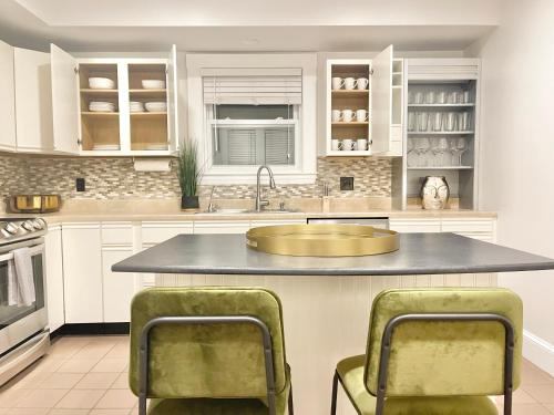 a kitchen with a large island with a sink at 5STAR Close2BOSTON Private Stylish HOME +W/D+Wi-Fi in Marlborough